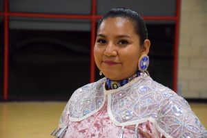 San Diego State University student Raelynn Bichitty is shown in the Aztec Recreation Center dressed in her traditional Native American jingle dress dancing attire. 